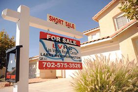 A short sale sign hangs outside a home for sale in Las Vegas, Nevada