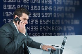 Forex broker on phone and laptop