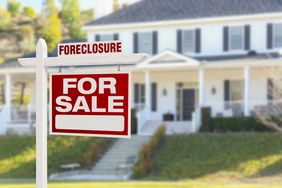 Foreclosure Home For Sale Sign in Front of Large House