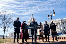 Senate Majority Leader Chuck Schumer (D-NY) speaks during a press conference about student debt outside the U.S. Capitol on February 4, 2021 in Washington, DC. Also pictured, L-R, Rep. Mondaire Jones (D-NY), Rep. Alma Adams (D-NC), Rep. Ilhan Omar (D-MN), Sen. Elizabeth Warren (D-MA) and Rep. Ayanna Pressley (D-MA). The group of Democrats re-introduced their resolution calling on President Joe Biden to take executive action to cancel up to $50,000 in debt for federal student loan borrowers. 