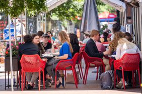 People eat outside during the lunch hour at a restaurant on Pennsylvania Avenue in the Capitol Hill neighborhood on May 21, 2021 in Washington, DC.