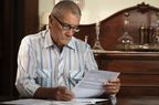 Older Man deciding if he should retire or not