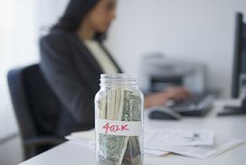 Woman with 401(k) jar