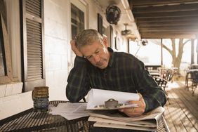 Business owner stressed doing paperwork