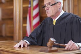 Judge banging gavel in court