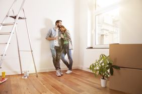 A young couple is moving into their new home.
