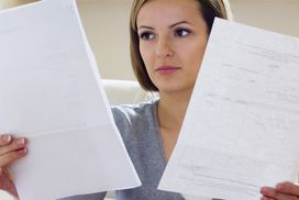 Woman reading through financial statements