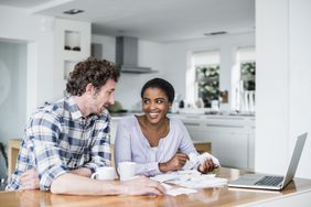 A happy couple balances their commingled finances