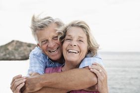 Older couple smiling and embracing
