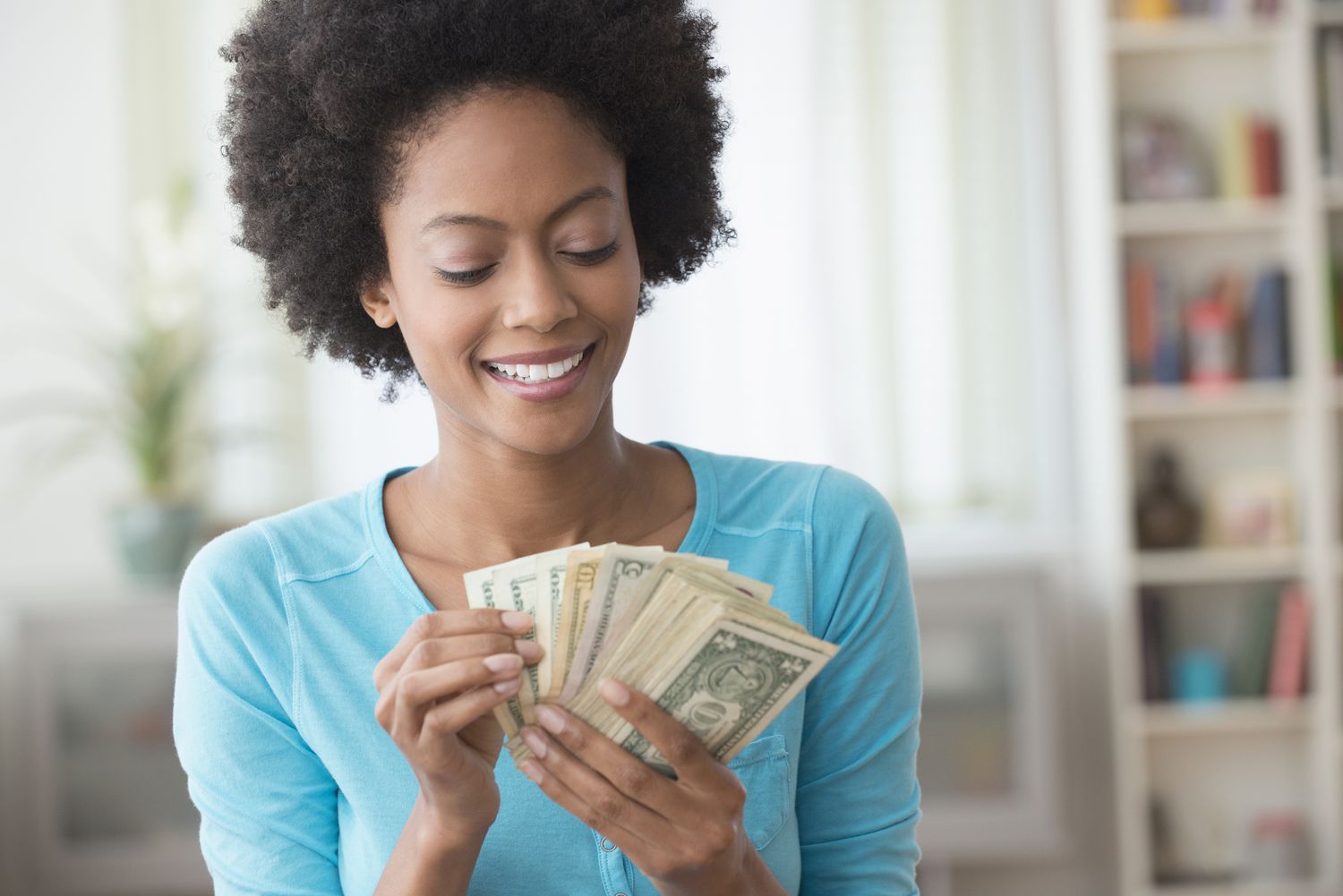 Woman with cash in hand