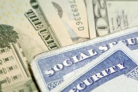 Social security cards on money
