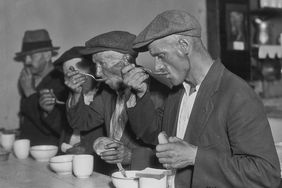 Men eating in a soup kitchen during the US Great Depression