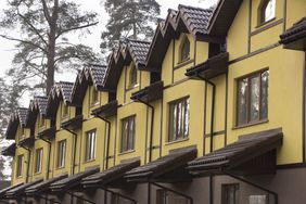 Close up of a row of new townhouses for sale on the real estate market.