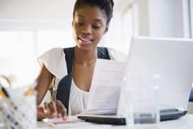 Woman at laptop managing her budget