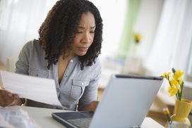 A woman views credit card details online